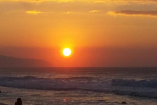 a sunset over a beach